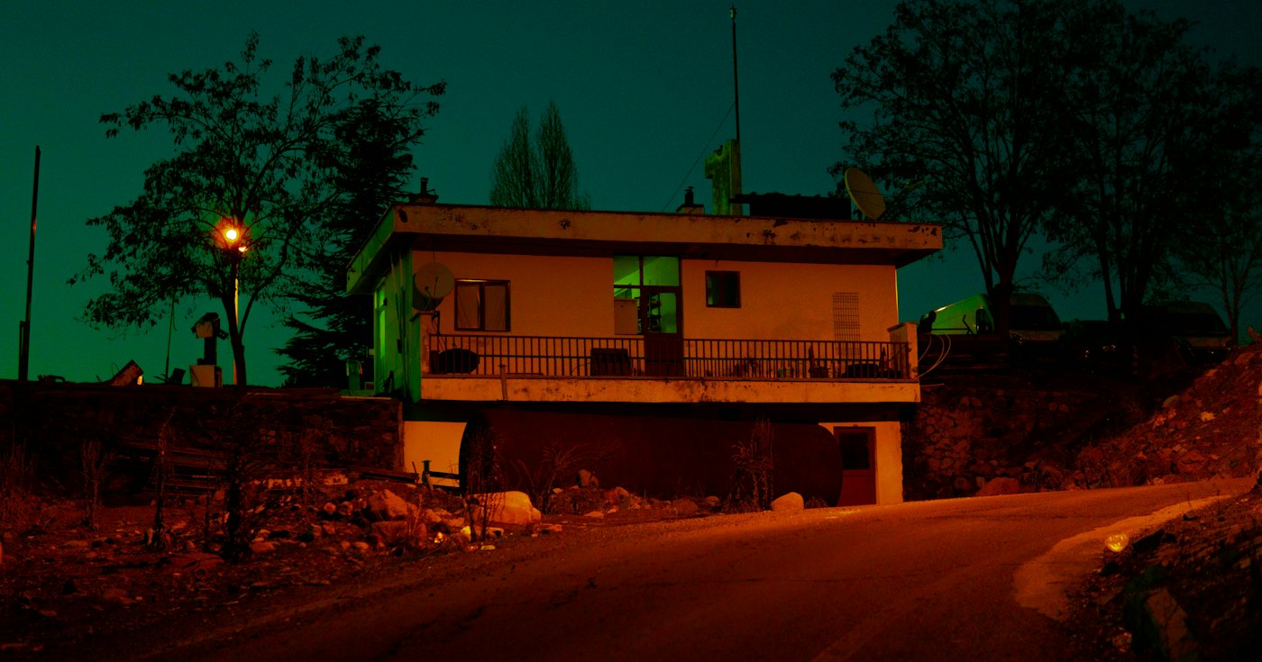 A small house lit up at night