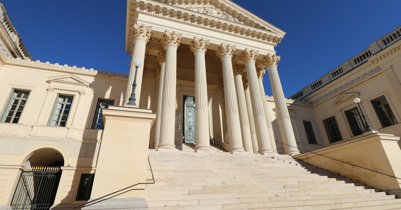 Courthouse with columns and a clock tower