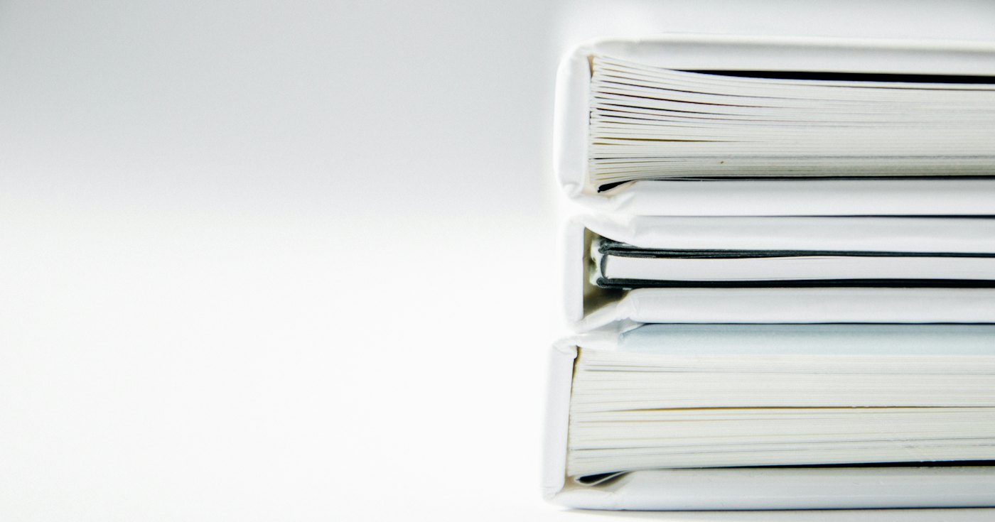 A stack of thick file folders
