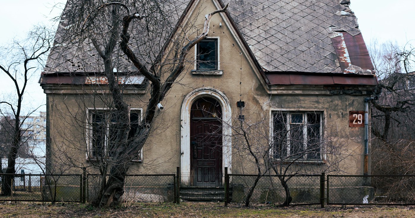 An old house behind a fence