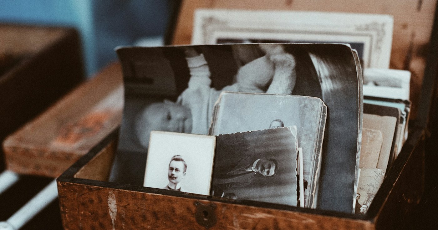 Old family photographs in a wooden chest