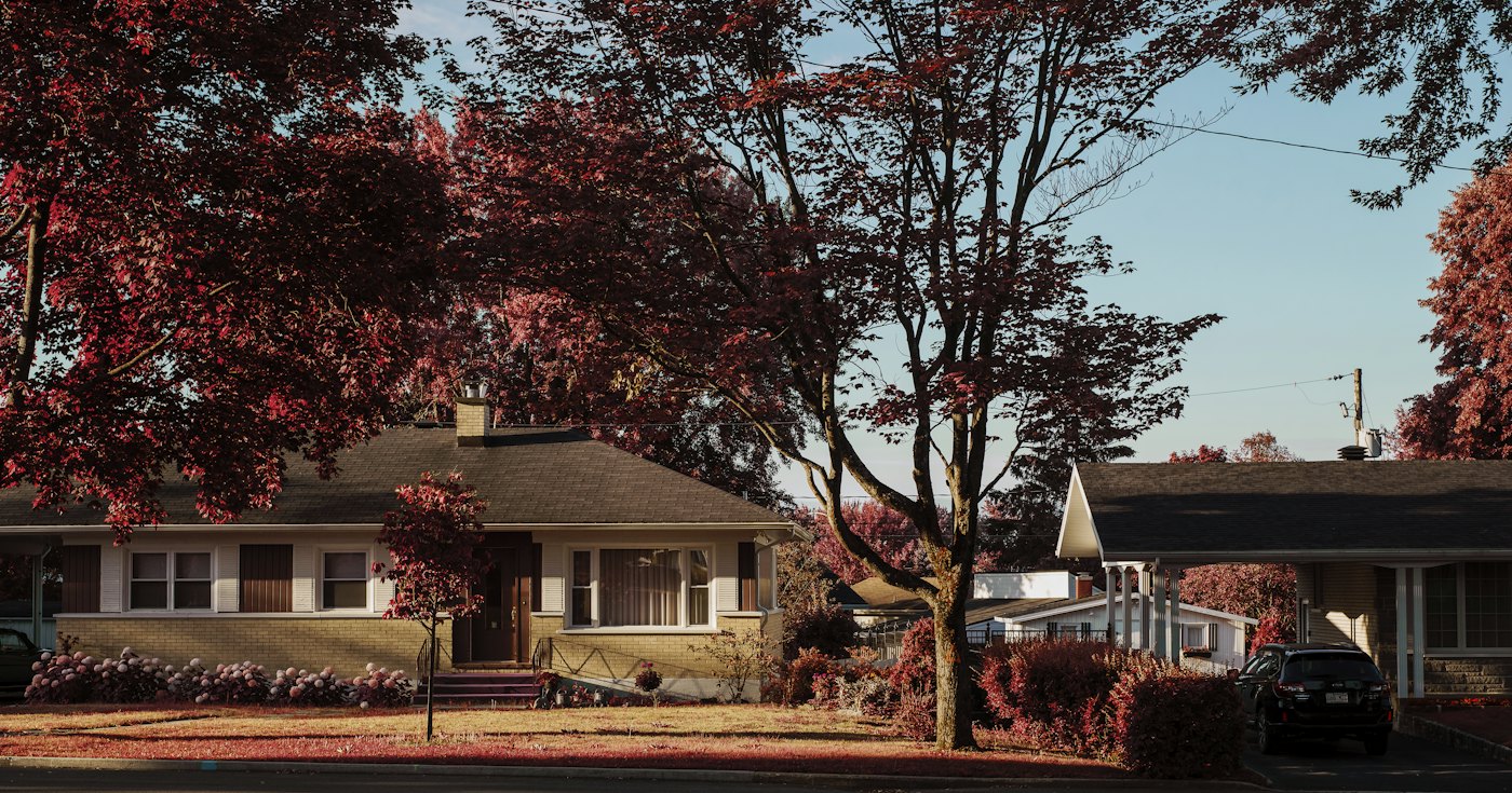 A family house with a car parked in front