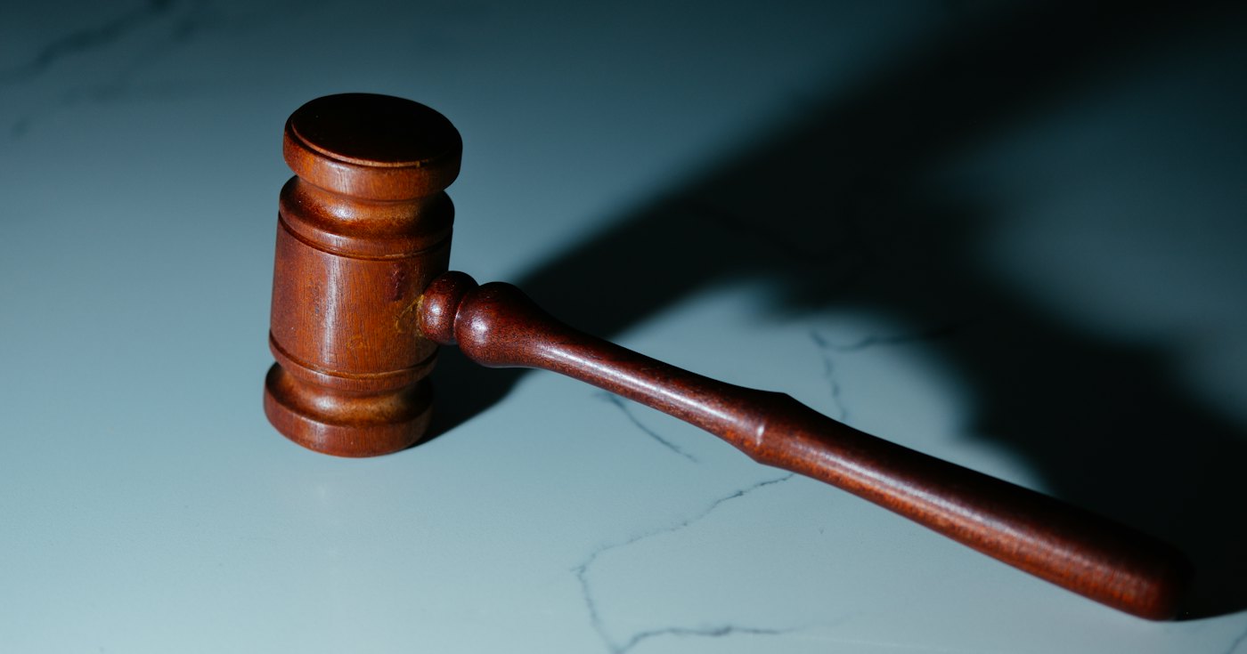 Judge's gavel on a courtroom desk