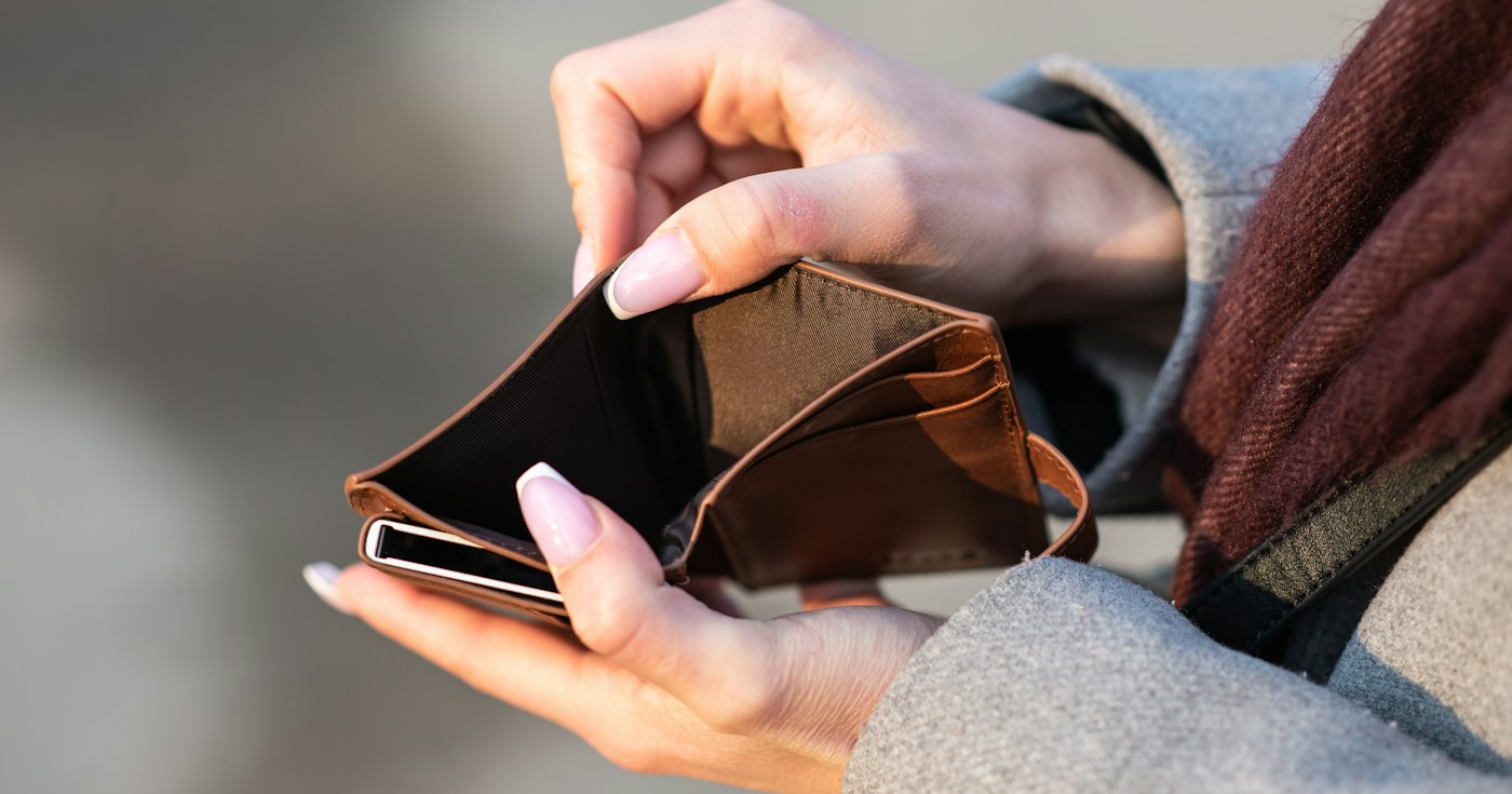 Hands holding an empty wallet