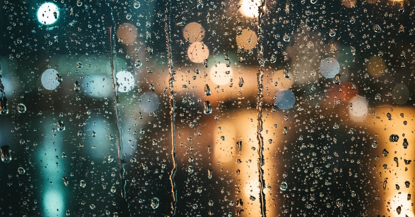 Raindrops on a window at night
